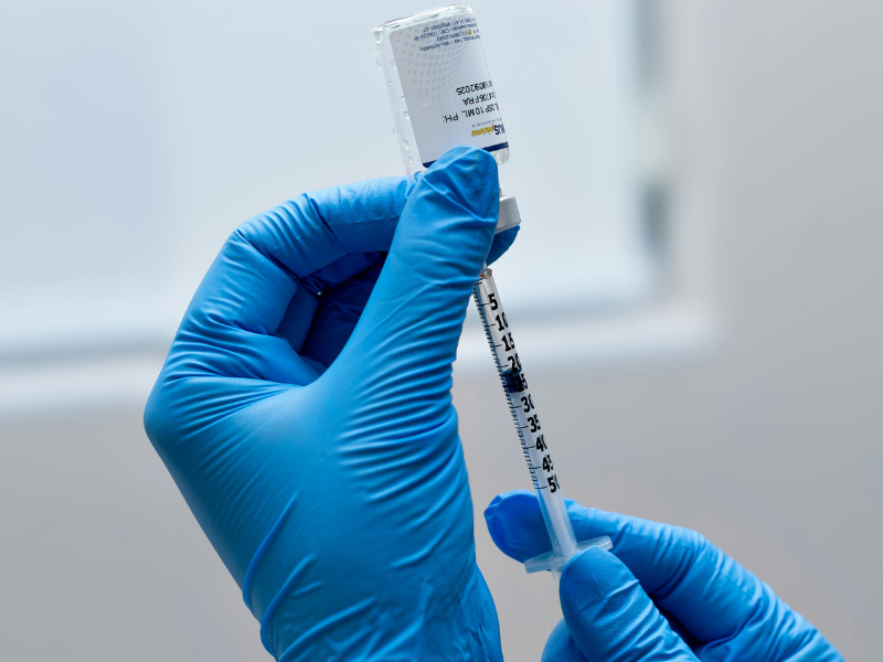 Vaccination Bali with medical staff preparing a vaccine injection